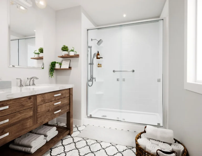 White Bath Fitter shower with glass doors beside a warm wood vanity