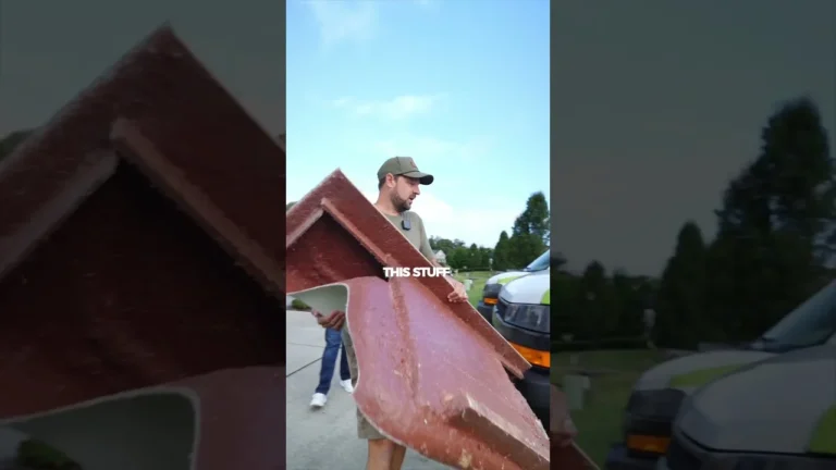 Bath Fitter installer next to removed fiberglass tub and shower units, video thumbnail