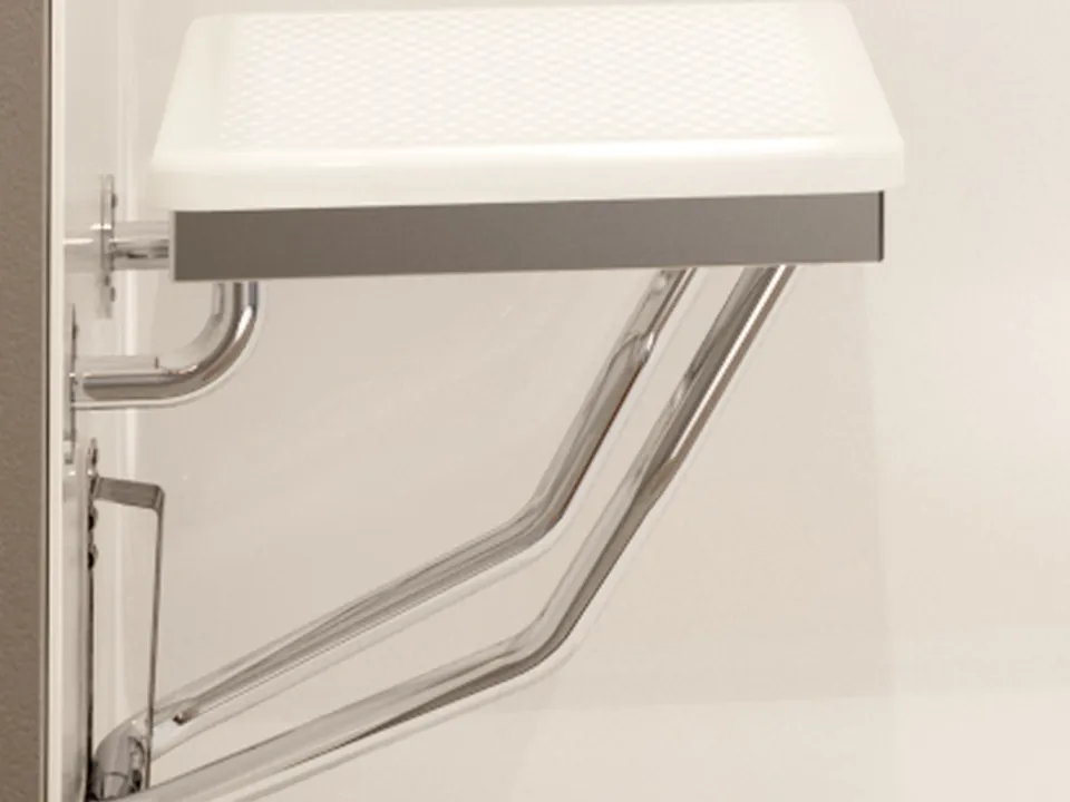 Folding shower seat — A seat provides a place to sit and folds away when more room is needed.