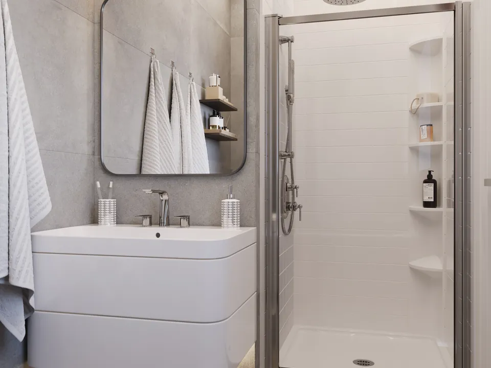 Montreal enclosure — A glass shower enclosure shown with white walls and chrome fixtures.