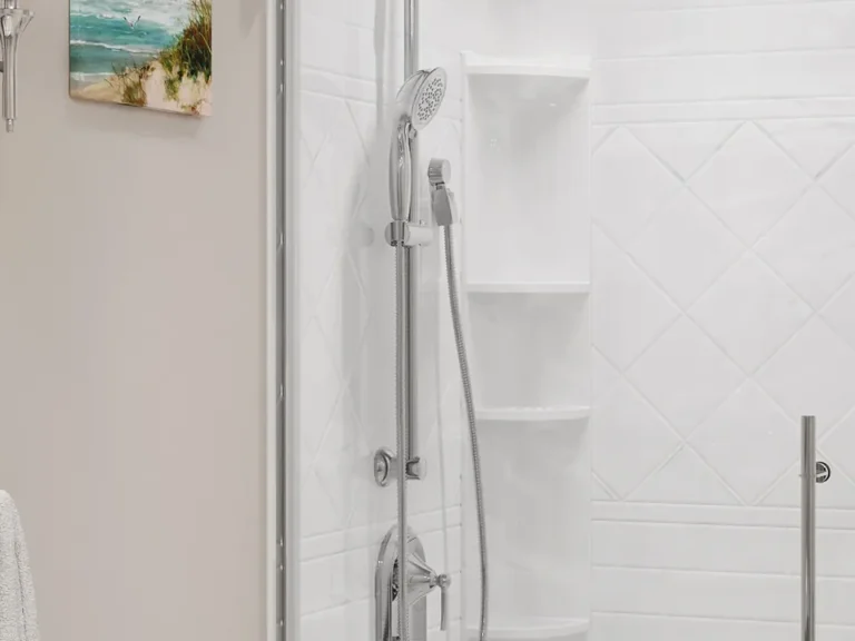 Roma · White Marble — A marble-look wall pattern shown with a glass shower enclosure.