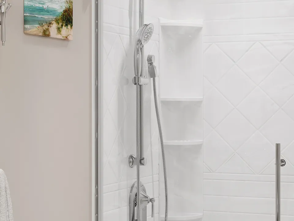 Roma · White Marble — A marble-look wall pattern shown with a glass shower enclosure.