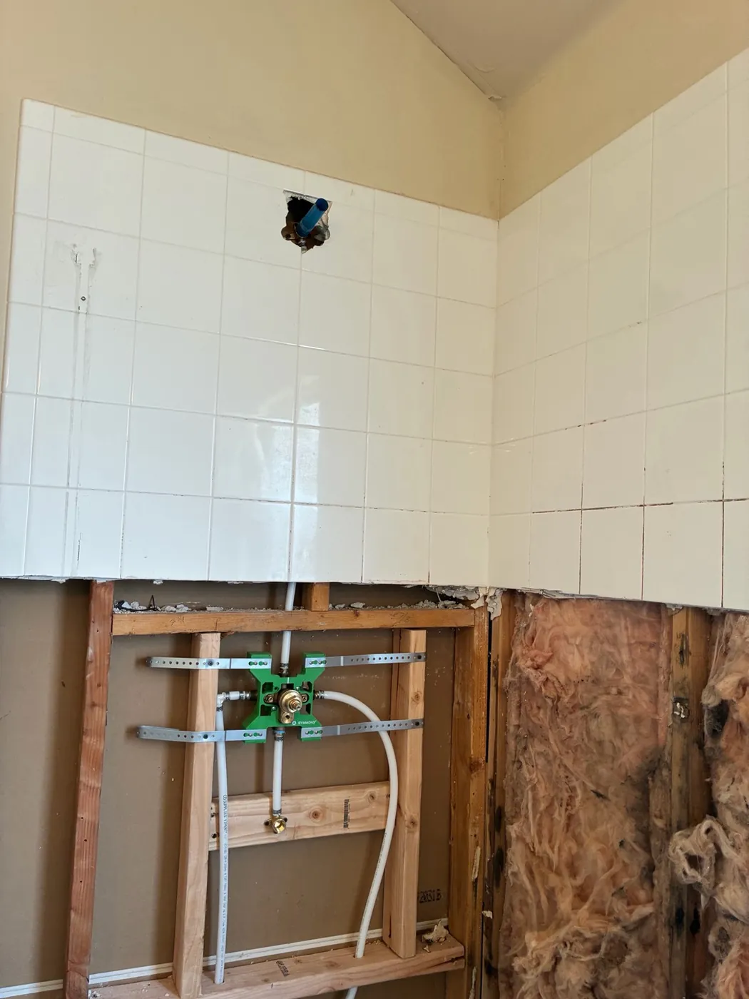 Yukon installation with exposed wall framing and new plumbing connections